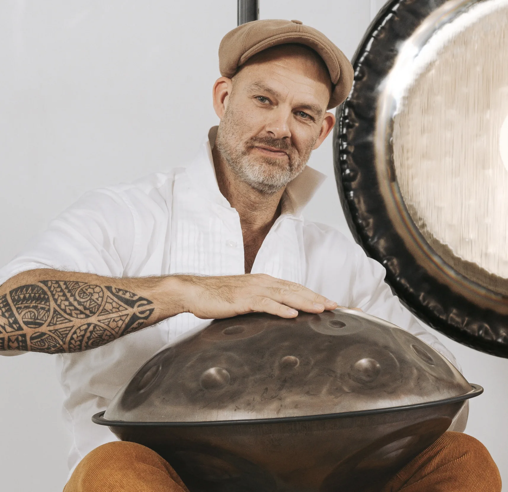 Musician presenting a large handpan Musician presenting a large handpan