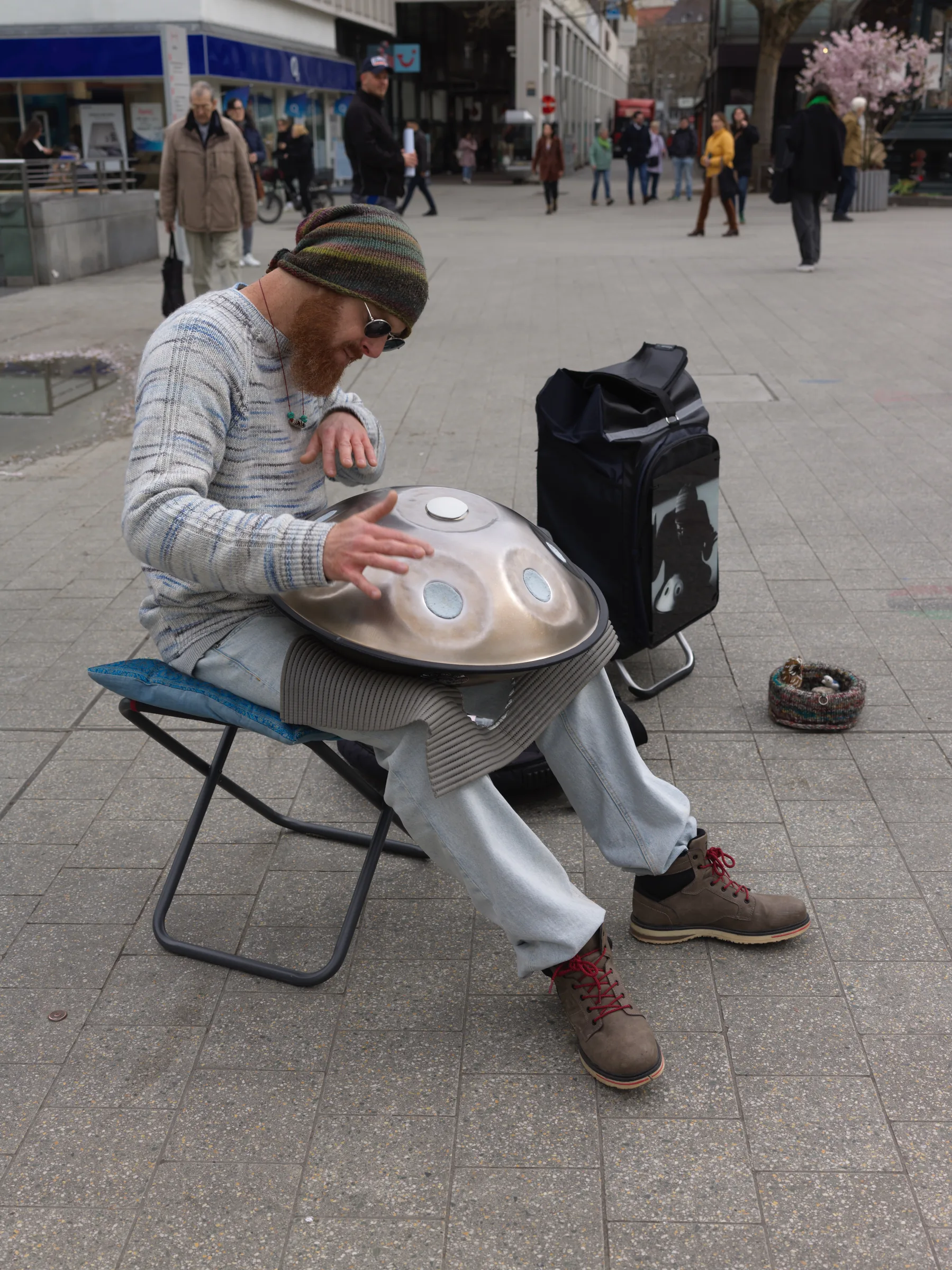 Street musician playing the handpan Street musician playing the handpan