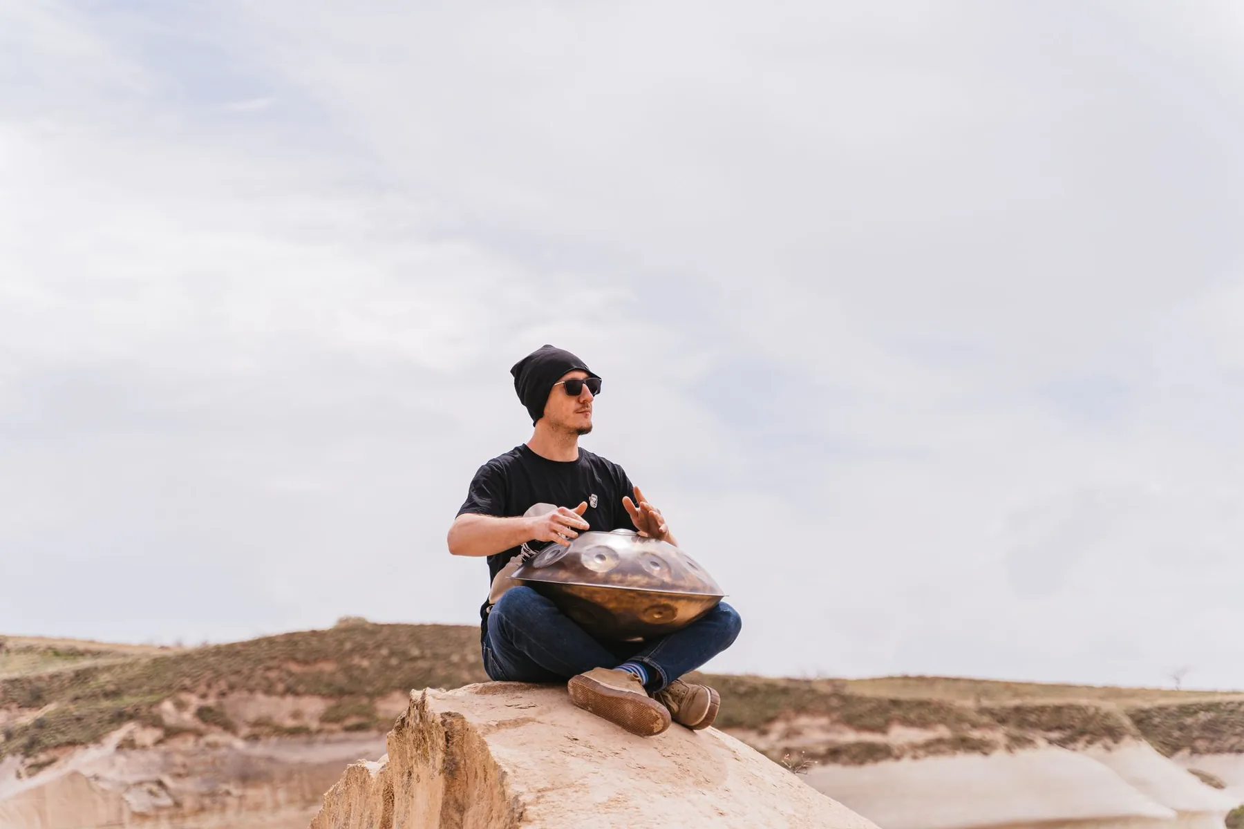 Artist playing the Handpan outdoors Artist playing the Handpan outdoors
