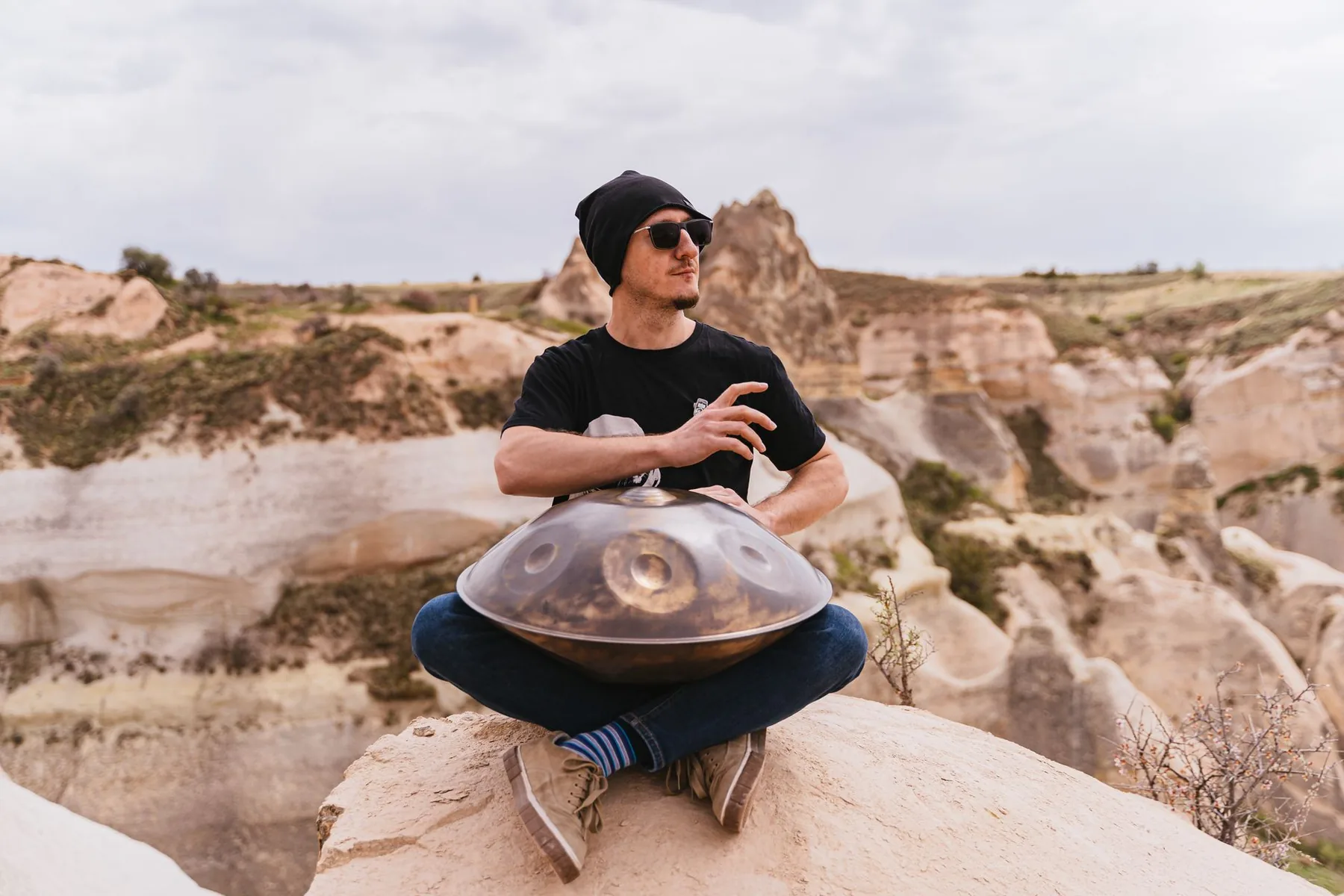Handpan player outdoors Handpan player outdoors