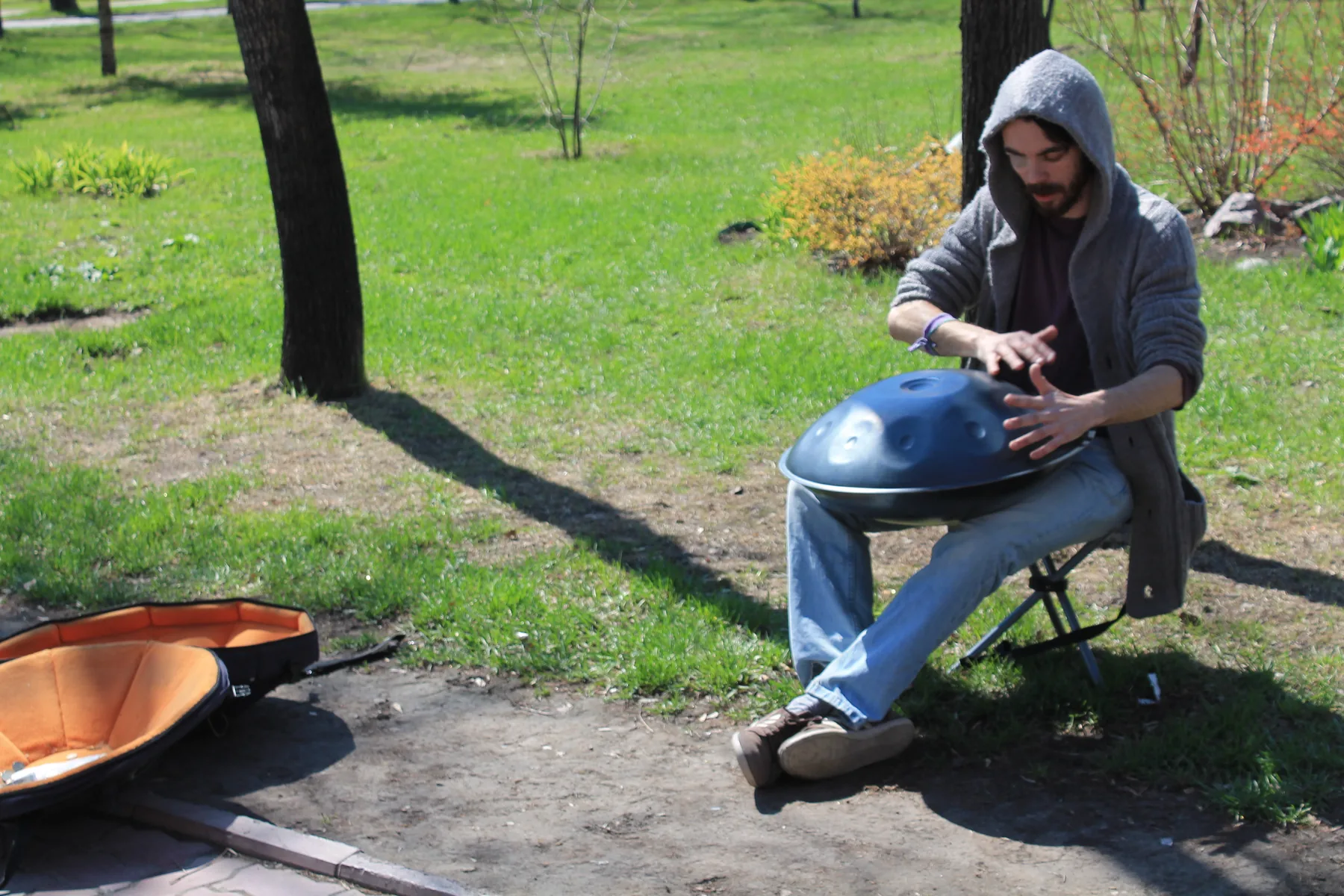 Acoustic handpan player outdoors Acoustic handpan player outdoors