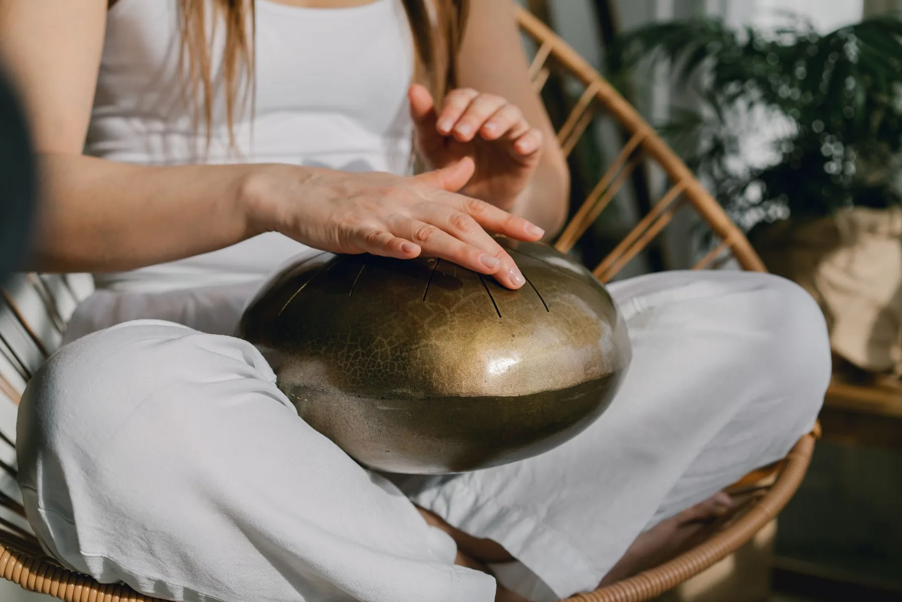 Female musician playing a melodic drum