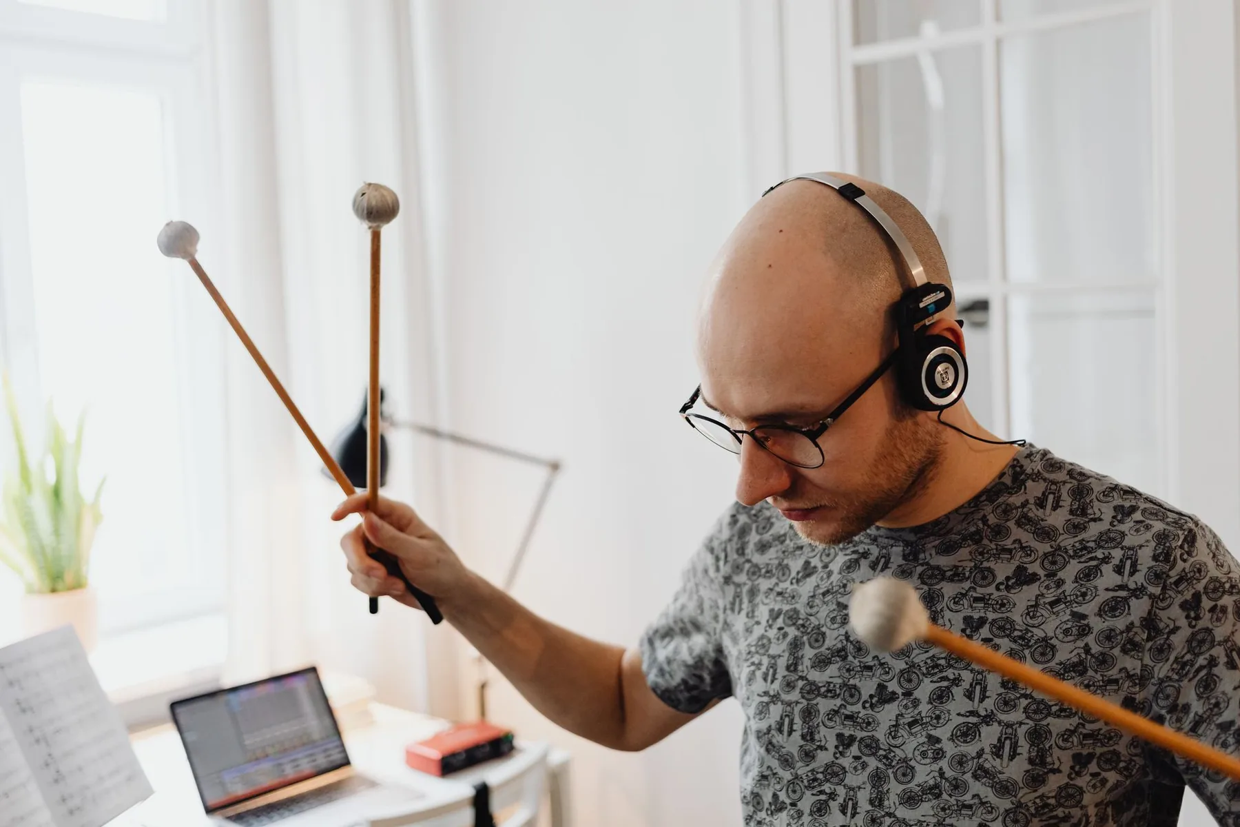 Percussionist playing with several mallets