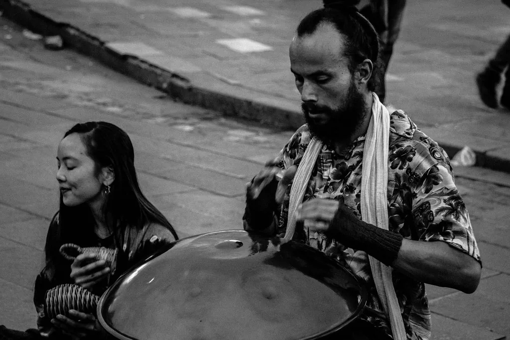 Musician playing a handpan in concert