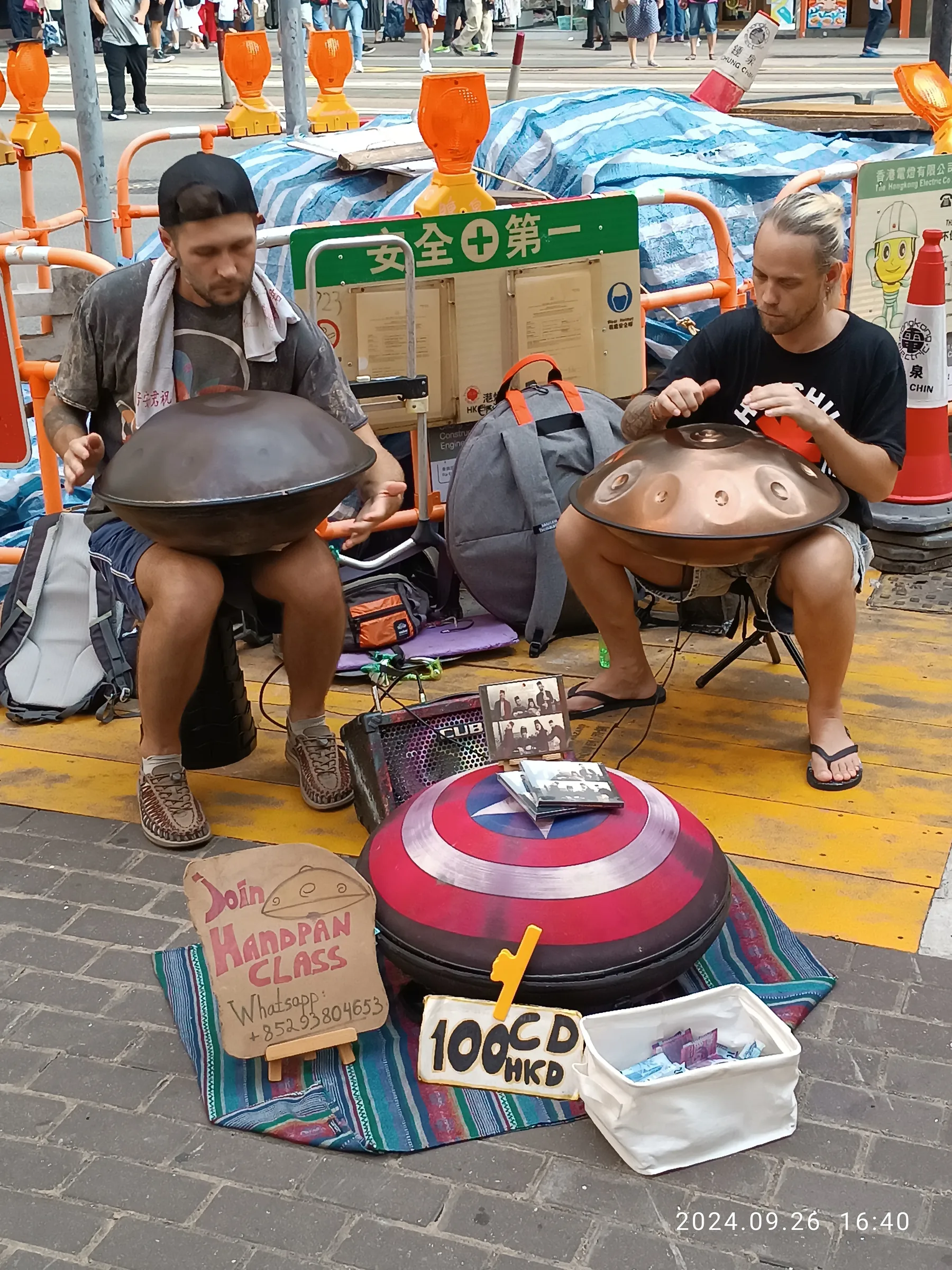 Musicians playing handpans in the street